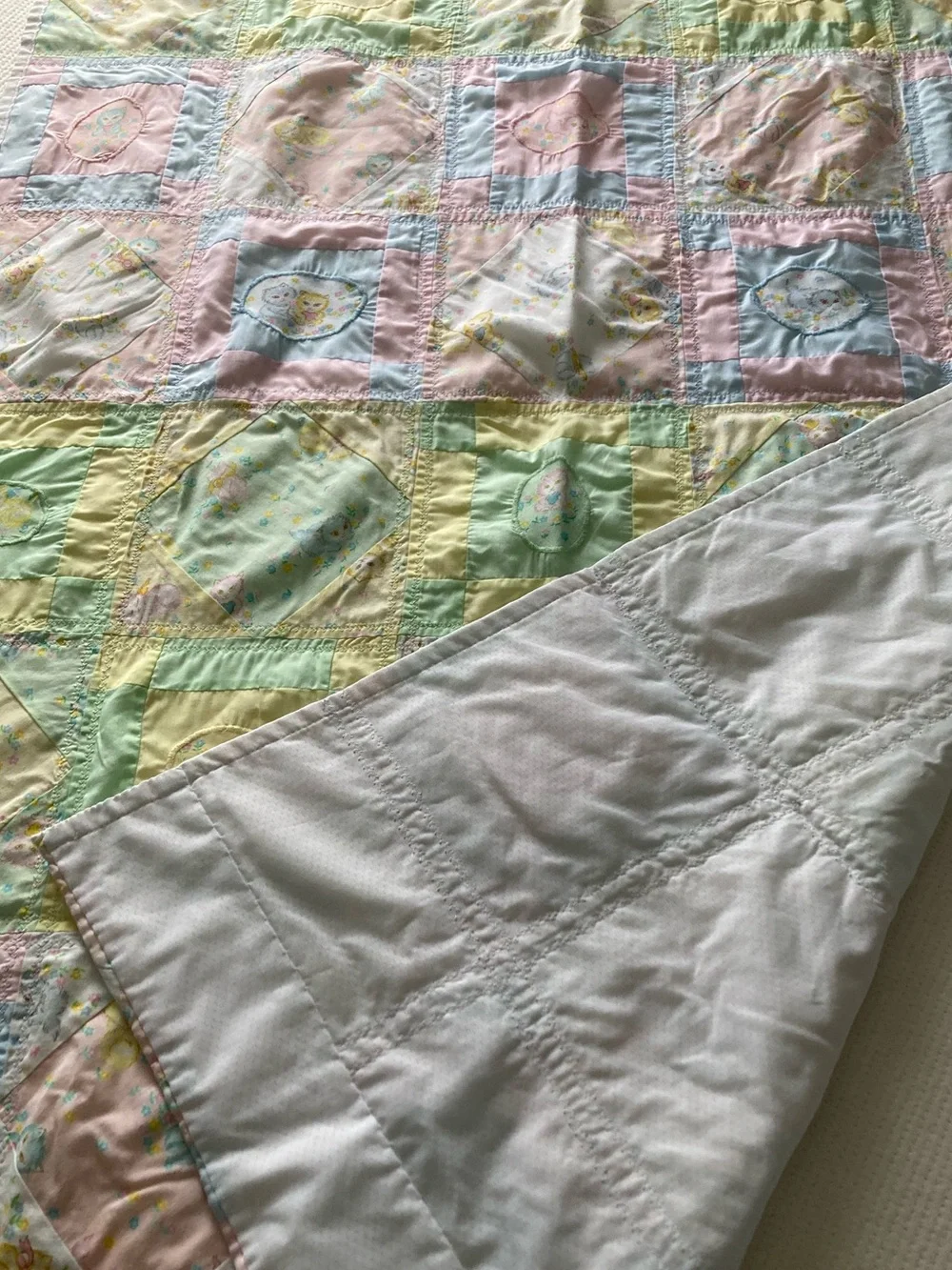 Handmade pastel kitten print baby quilt